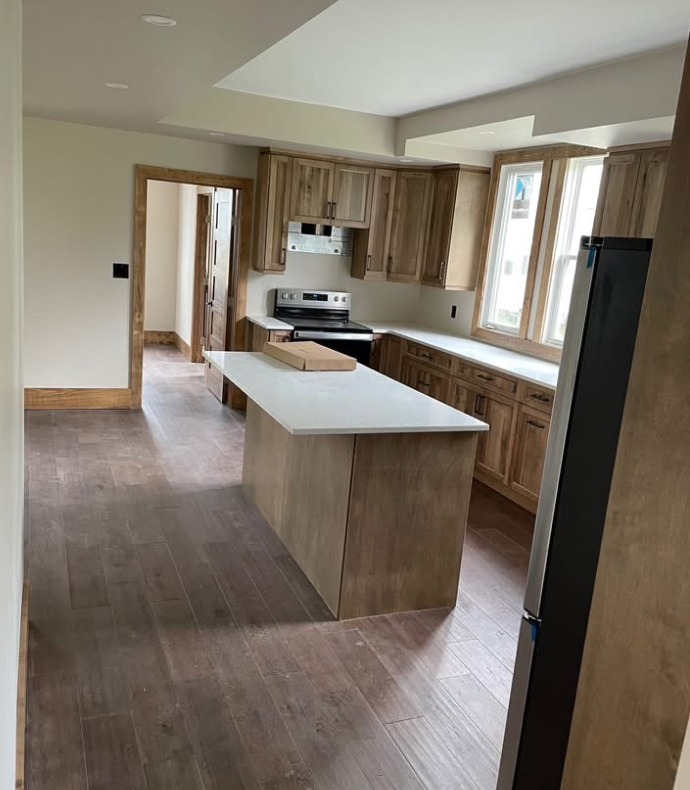 kitchen remodel including island, windows, wood cabinets trim and floor (finished renovation)